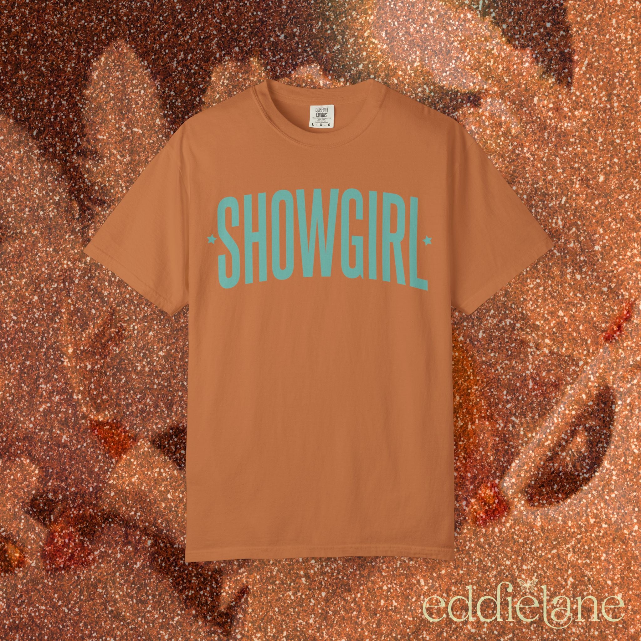 yam comfort colors graphic tee that says 'SHOWGIRL' with two small stars 

yam showgirl tee